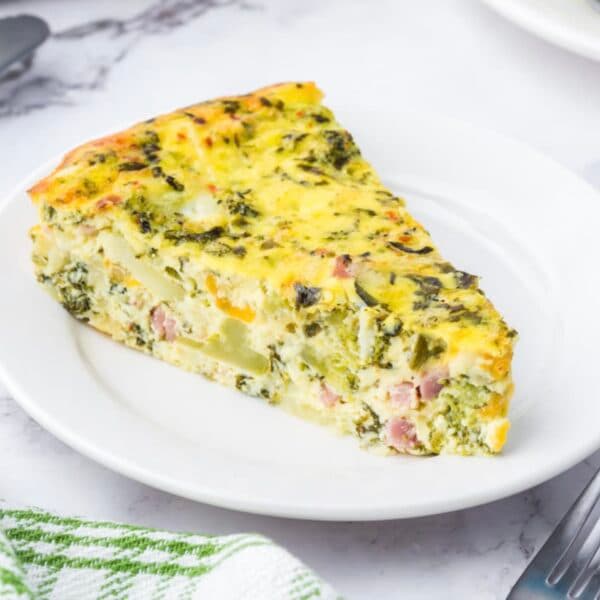A slice of crustless gluten-free vegetarian Just Love Quiche on a plate